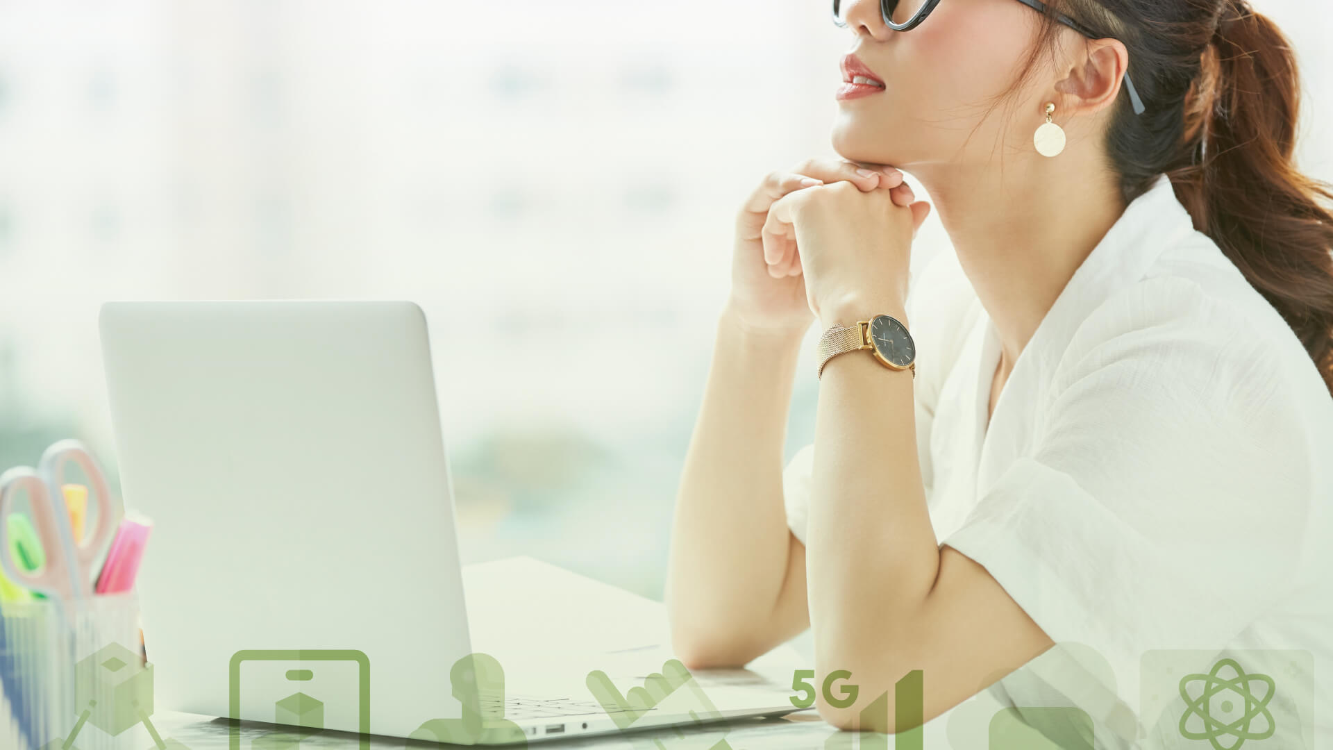 Article Banner Image - A photo of a woman sitting in front of her laptop